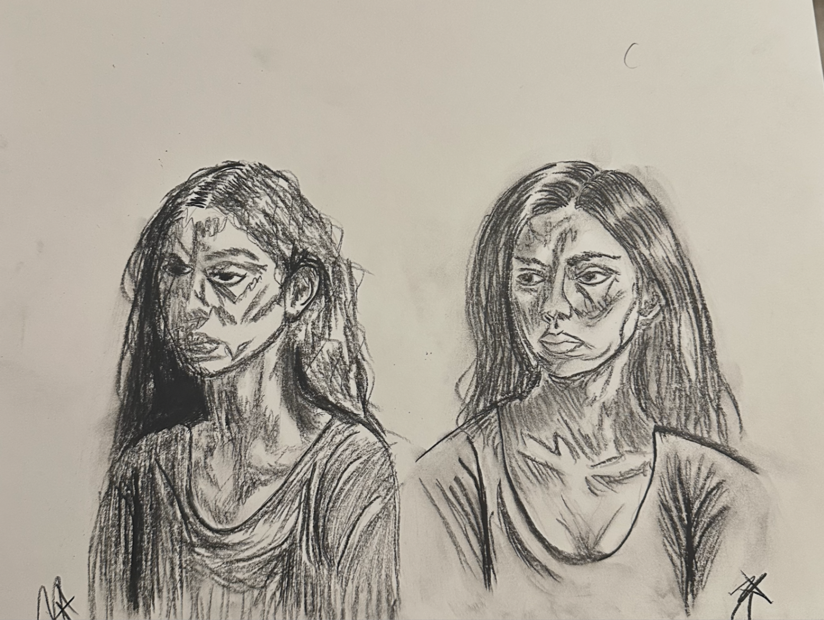 Charcoal double portrait study of two faces